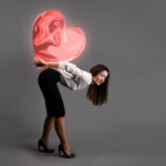 Woman carrying a big heart